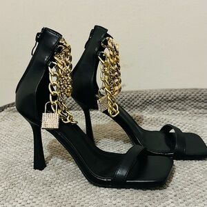 Black Stiletto Sandals with Gold Chain Accent